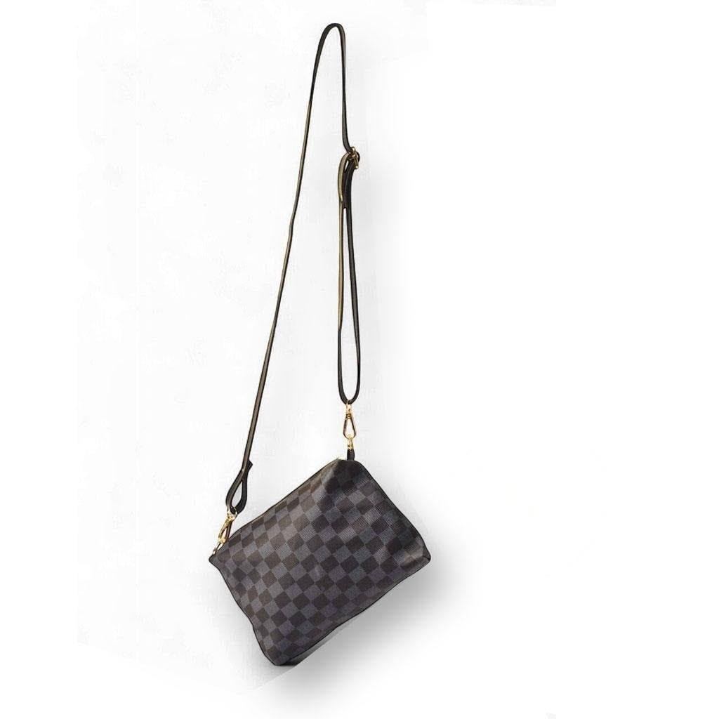 Crafted from high-quality PU leather, this printed shoulder bag combines durability with style
